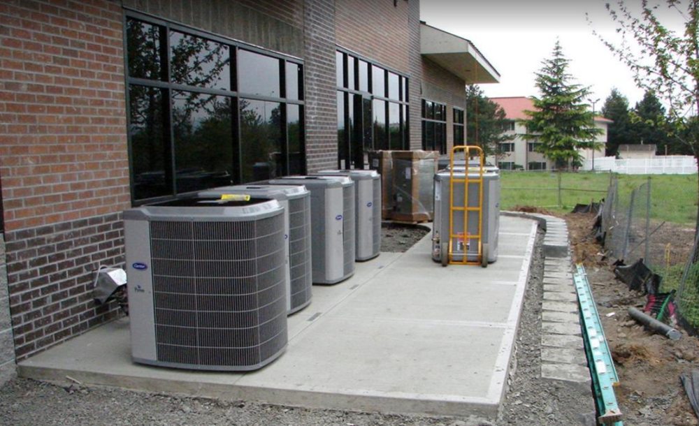 Commercial heat pump installation in Atlanta GA with multiple outdoor HVAC systems.