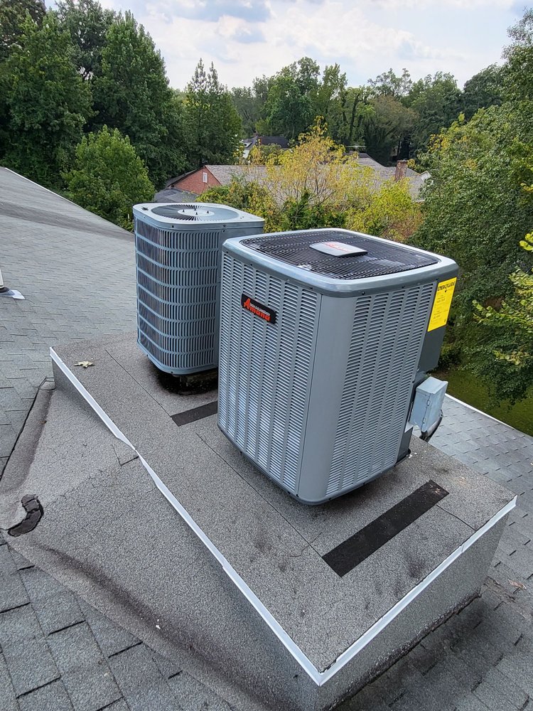Residential heat pumps in Atlanta GA installed on rooftop platform.